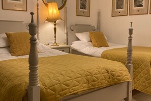 Large twin en-suite overlooking the gardens z Bright and sunny filled with quirky vintage furnishings. Hand made mattresses on the European sized twin beds.