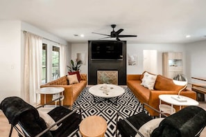 Spacious living area with comfortable couches, perfect for gathering with friends and family.
