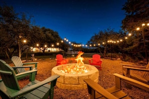 Enjoy fireside chats and stargazing in this cozy outdoor space.