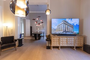 The dining room can comfortably seat up to 8 guests and offers vibrant art