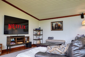 Enjoy a movie on an 85" smart TV w/ 9.1.2 Dolby surround sound.