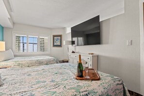 Get a cinematic experience in this cozy bedroom with 2 plush queen beds and a gigantic 70" Smart TV perfect for streaming your favorite apps or movies.  Plenty of clothing storage options available as well for those longer stays.