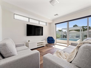 Relax in comfort and style in our cozy living room, designed for ultimate relaxation.