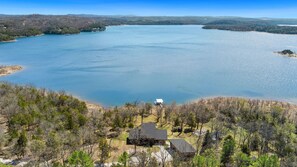 The huge windows throughout the house flood the space with natural light and provide picturesque vistas of the lake.