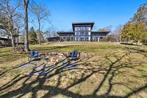 Whether you're relaxing inside or enjoying the lake and fire pit outside, you'll love the serene atmosphere.