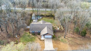 At home enjoy amenities for 8 in our 4-bedroom, 2-bathroom home including a fully stocked kitchen, cozy living room, and large fenced in back yard.