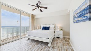 Master bedroom with king bed TV ensuite bathroom and balcony access