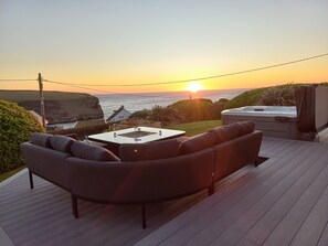 Sun setting over the sea on the deack
