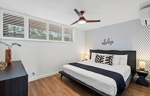 Primary bedroom features a king bed
