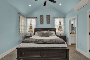 The cozy bedroom offers a plush king bed, perfect for stretching out and enjoying a restful night’s sleep.