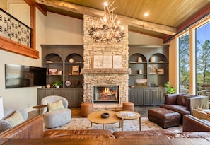 Gather around the fire and enjoy family time in the spacious living room.