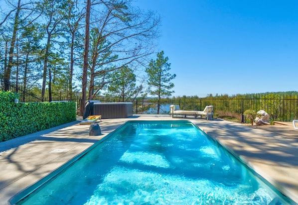 Dive into the sparkling pool while enjoying the beautiful lake views—perfect for cooling off on a warm day.