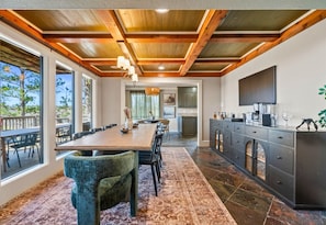 Host memorable dinners in this elegant dining room, where beautiful wood accents and stunning lake views create an unforgettable setting.