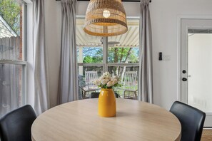 Inviting dining area overlooking flower gardens
