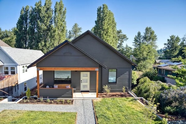 Front with covered porch. Great spot for morning coffee on sunny days.