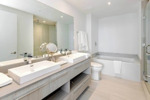 Our stunning Master bathroom, where you can decide whether to take a good shower or go right into the bathtub for a relaxing bubble bath! It includes towels, a hairdryer, and a starter kit.