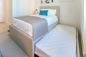 Our beautiful Second Bedroom comes with a full trundle bed (Full and single size).