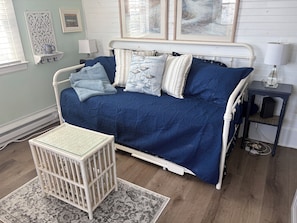 Trundle bed serves as a couch and daybed during the day.