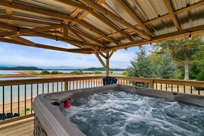 Relax in the hot tub within the cozy gazebo, all while soaking in the stunning views of the lake – pure tranquility at its best