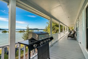 Grillin' and chillin' with a lakeview – the perfect way to cook up that fresh catch, then relax and enjoy the beauty of Douglas Lake from the porch
