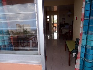 From front balcony to inside apartment and back balcony.