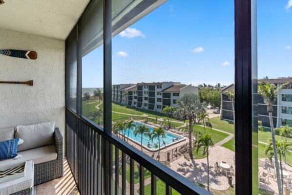 Large Enclosed Lanai with Partial Gulf, Pool, and Courtyard view