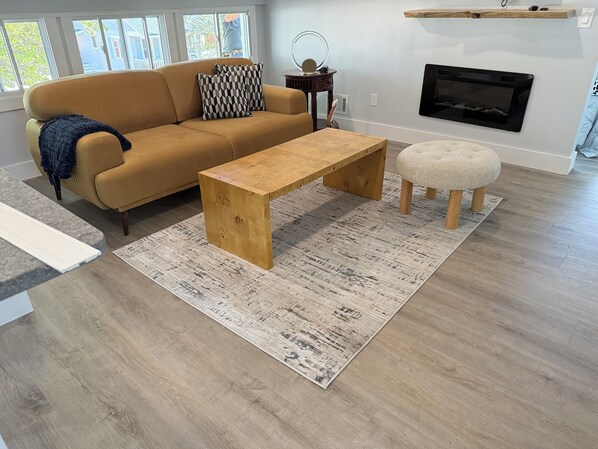 Living area with TV and eating/desk area