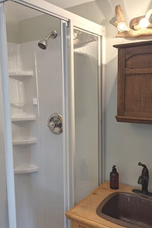 Shower with hot water, sink