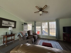 Living area with views of large yard