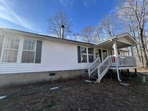 Sidewalk and steps leading to front door.