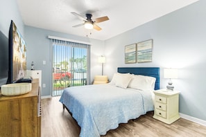Rest easy in the master bedroom featuring a comfortable queen-sized bed and a calm, inviting atmosphere