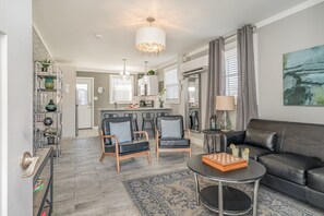 1st Unit: Relax in style with cozy seating, modern decor, and a seamless flow to the kitchen—perfect for comfort and connection!
