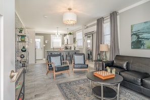 1st Unit: Relax in style with cozy seating, modern decor, and a seamless flow to the kitchen—perfect for comfort and connection!