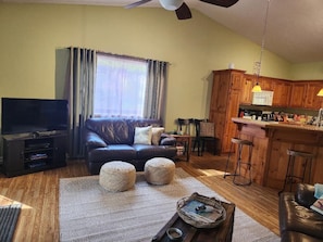 Family Room - leather sofa and loveseat, expandable table w/ four chairs