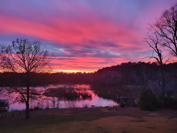 Our spacious backyard is packed with fun—kayaking, cornhole, and scenic sunset views.