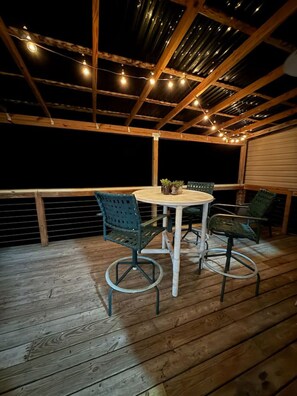 Step out onto the back deck and take in stunning views of Lake Gaston! With comfortable seating, a high-top table and chairs, and partial covering, it’s the perfect spot to sip your morning coffee or unwind at sunset.