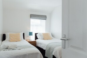 The Hayloft twin bedroom at Trevalgan Farm Holidays