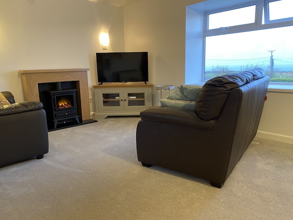 The Granary lounge with 42" smart TV at Trevalgan Farm Holidays