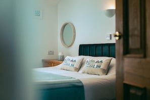 The Granary master bedroom at Trevalgan Farm Holidays