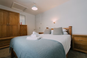 The Carthouse master bedroom at Trevalgan Farm Holidays