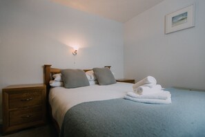 The Carthouse master bedroom at Trevalgan Farm Holidays