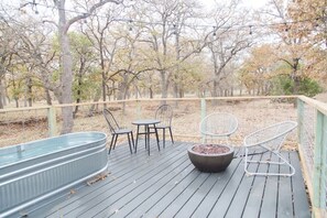 Firepit, stock tank pool, and table.
