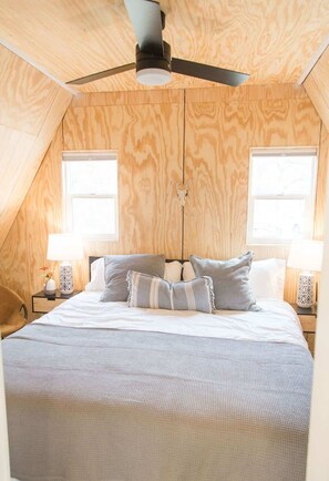 King-sized bed with 400 thread count sheets & blackout shades.