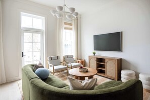 Spacious living room with seating for your entire group + TV!