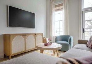 Spacious living room with seating for your entire group + TV!