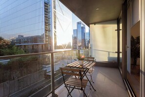 Enjoy stunning city skyline views from your private balcony, perfect for morning coffee or evening relaxation.