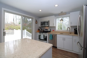 Kitchen showing deck access