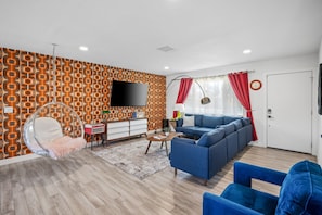 Brand new, 7th avenue L couch, floating sphere chair, smart tv.