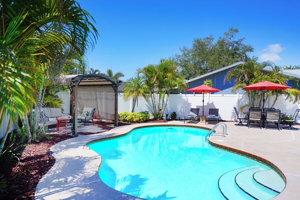 Large, private backyard with heatted pool is a great getaway.