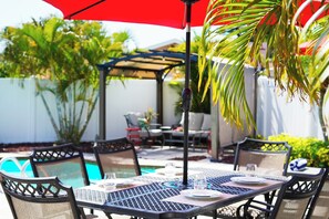 Poolside dining is a nice way to relax after a day at the beach.